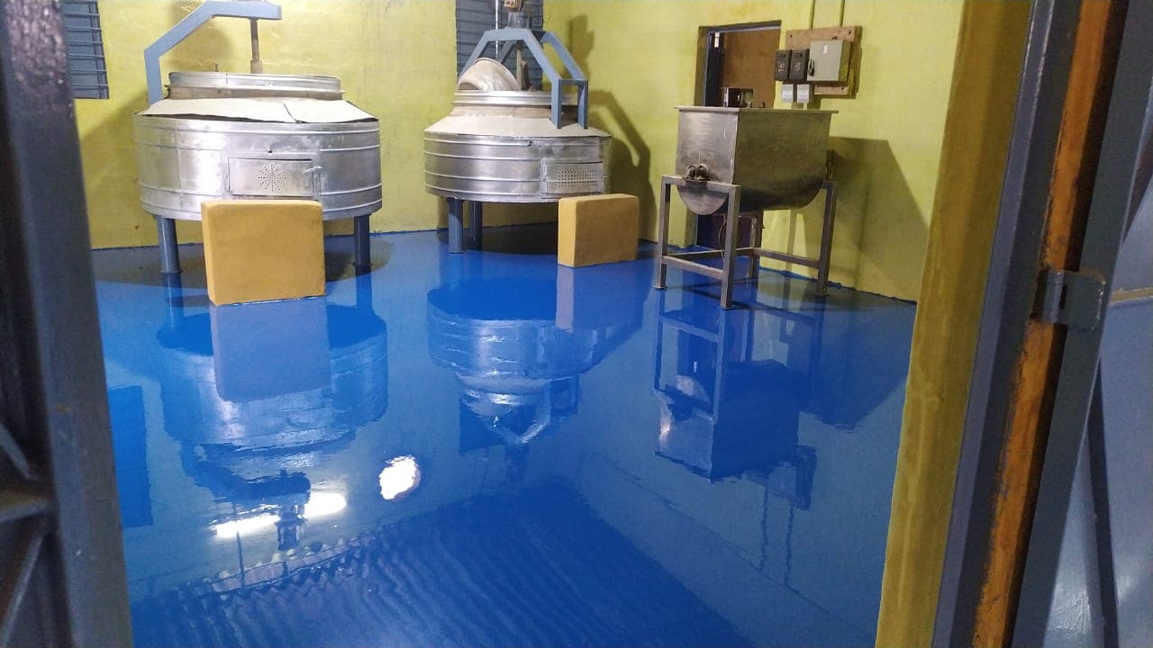 Mixing vessels and a hopper on the production floor